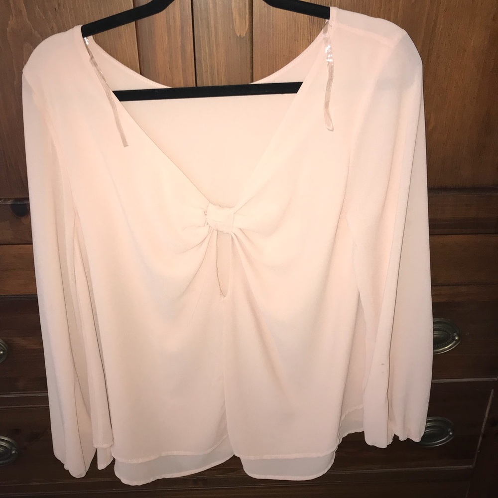 Orange ish long sleeve blouse with bow in back
